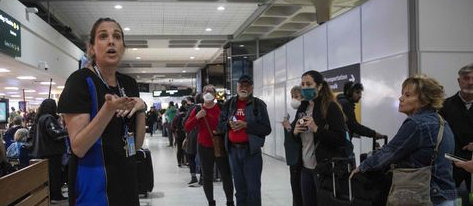 A Southwest Airlines supervisor addresses people waiting in a customer service line as delays and cancellations rocked the airline last December.